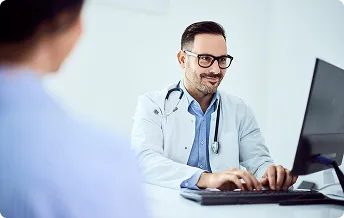 doctor-typing-with-patient